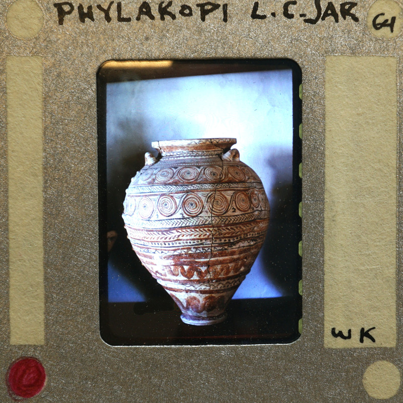 Large reassembled jar in profile with lots of painted decorations.