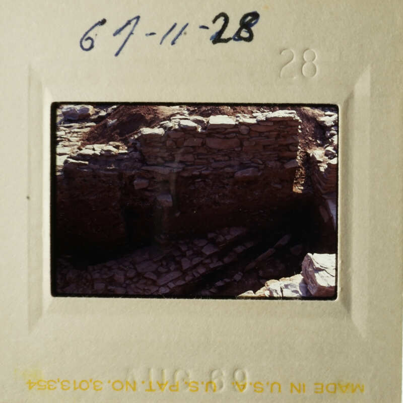 A photograph of an ancient stone structure, possibly ruins, with a handwritten note indicating the date and location.