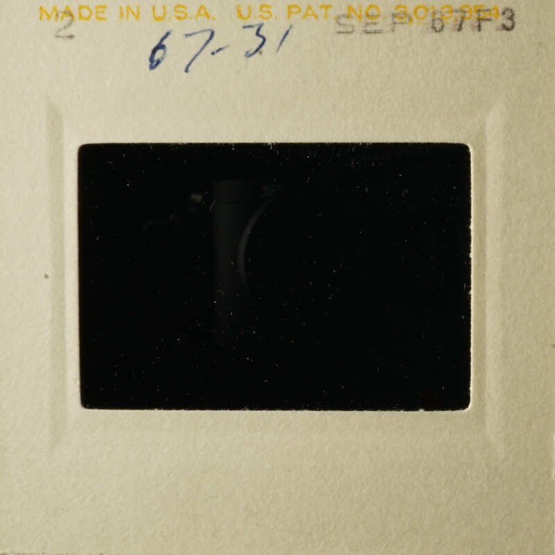 The photograph shows an old, black and white photo within a frame.