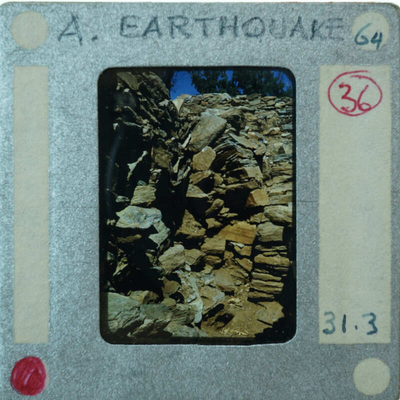 A vintage film strip with a label indicating an earthquake scene.