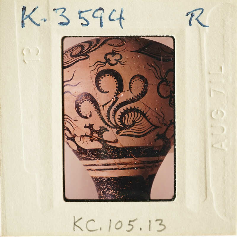 Ancient vase with intricate designs on display.