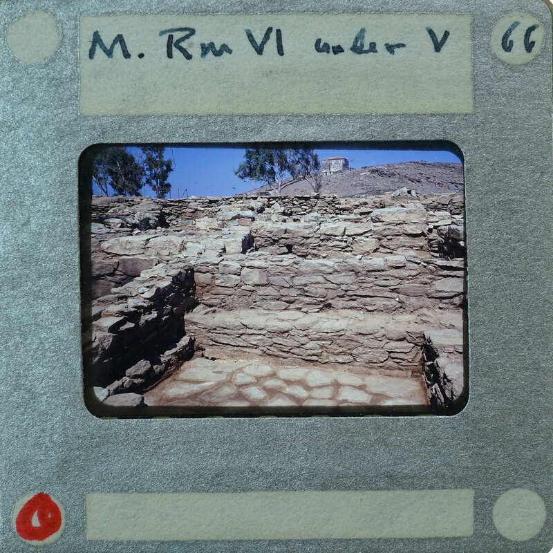 An old photograph of a stone structure, possibly ruins, with a white border and handwritten notes.
