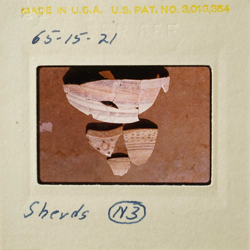 Photograph of ancient pottery shards on display.