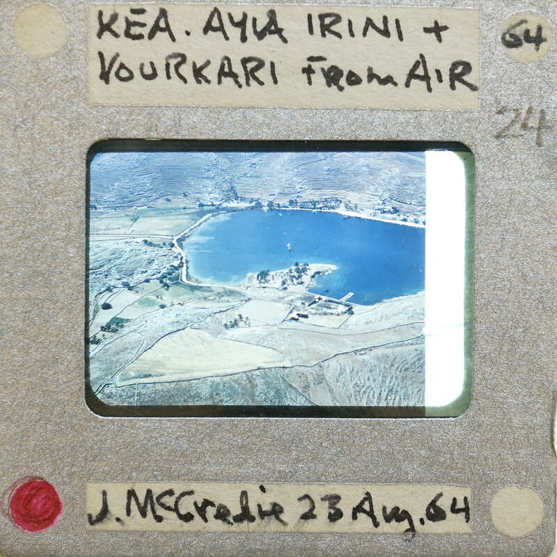 Aerial photograph of a lake with land formations.