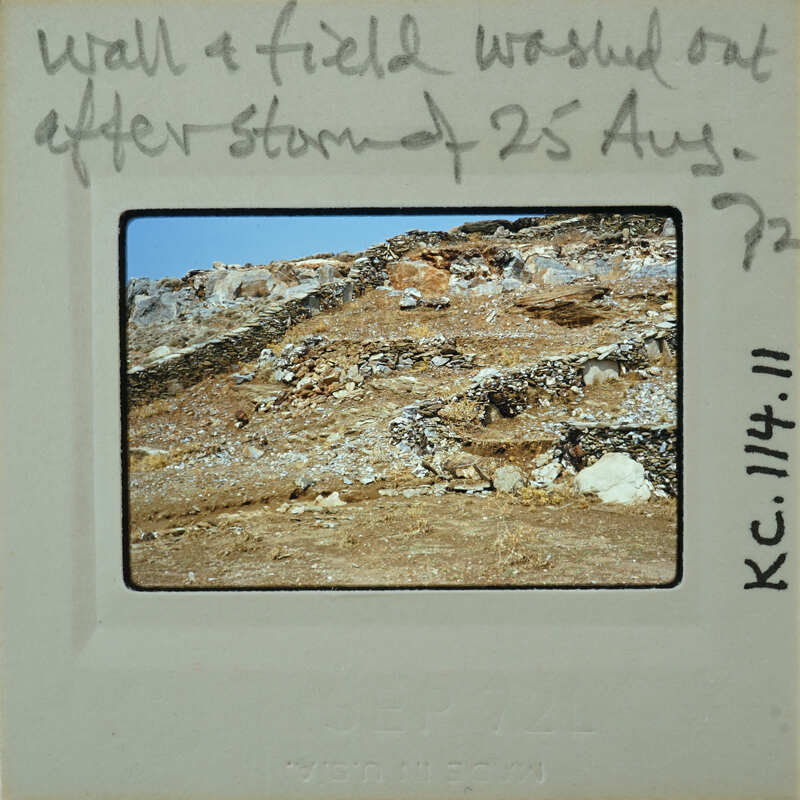 A vintage photo of a rocky landscape with handwritten notes on the back.