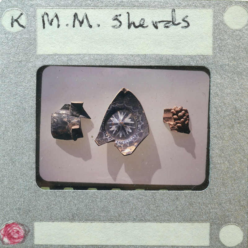 Three fragments of pottery with different designs and textures, displayed on a white surface with labels.