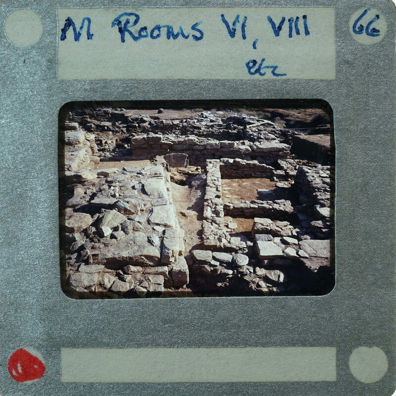 A photograph of ancient ruins with a film strip label.