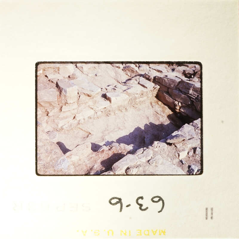 Old stone ruins with shadows, photographed on film.