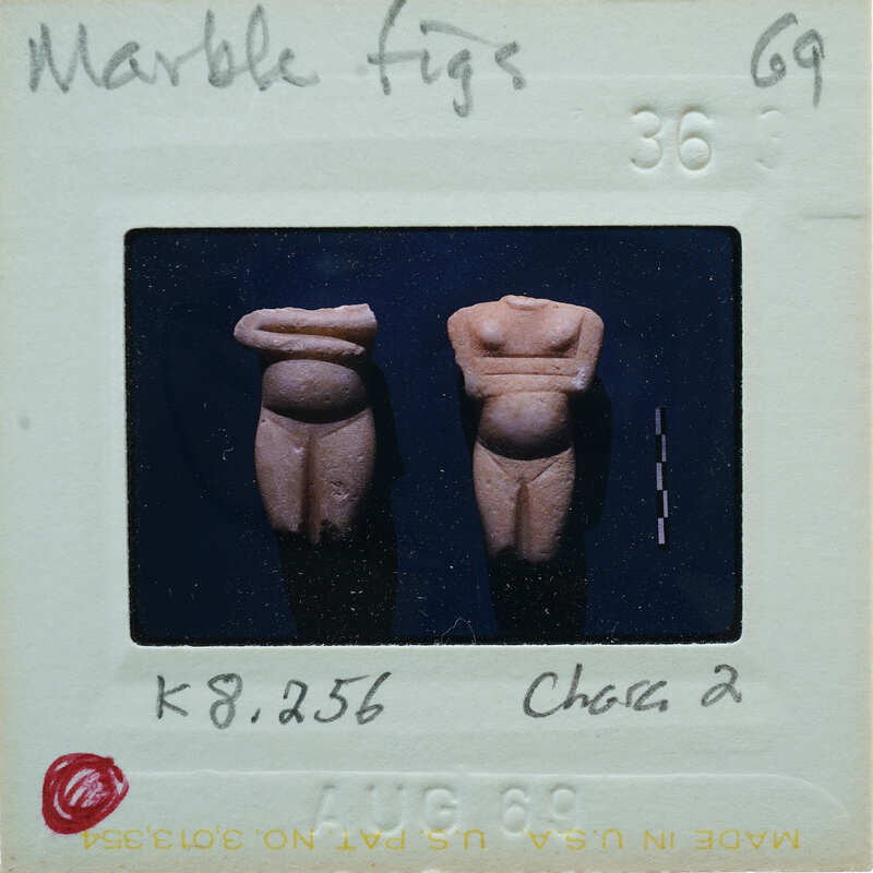 Two headless marble figurines from the front.