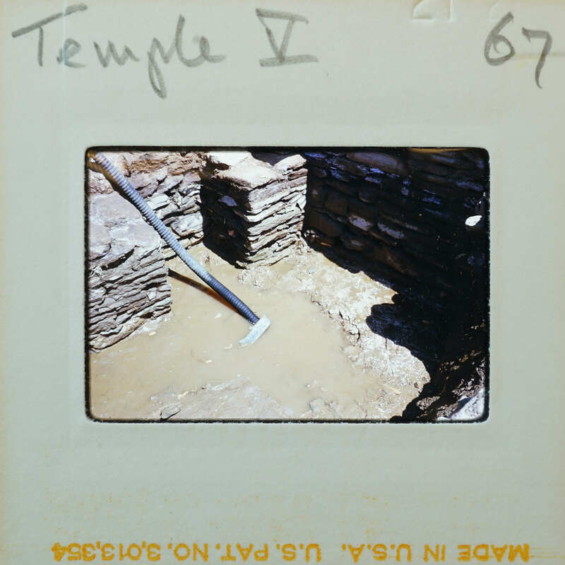 Excavated wall with flooded interior.