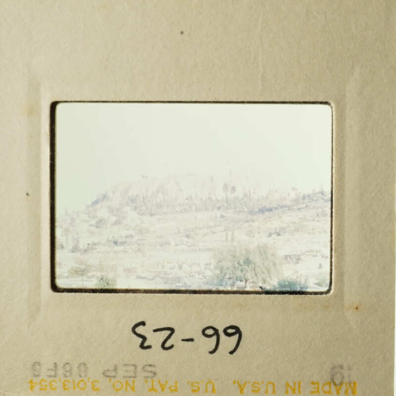 "Two vintage photos on display, featuring cityscapes and landmarks."