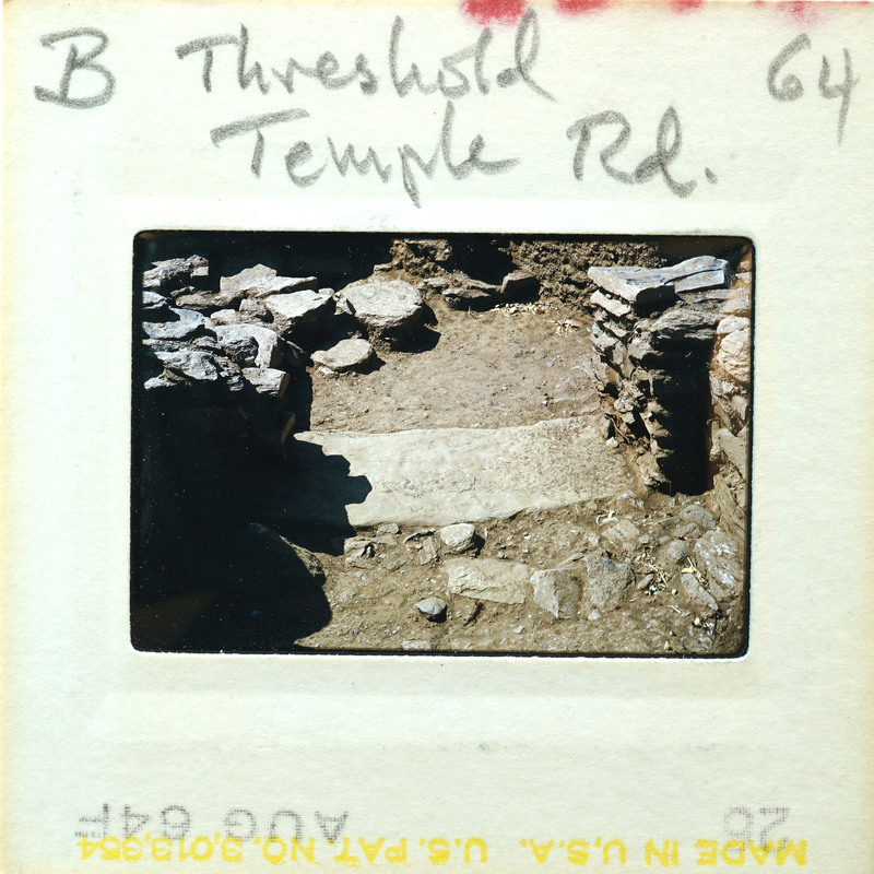 Old photo of a stone structure with stairs, possibly ruins or an ancient site.
