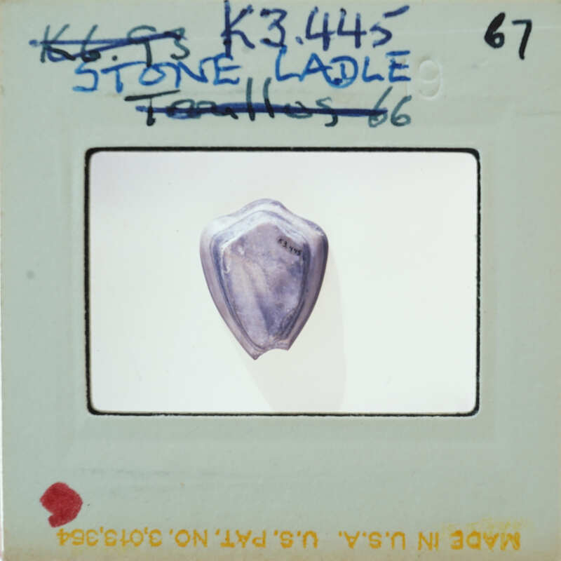 Blue stone with a smooth, rounded surface on a white background.