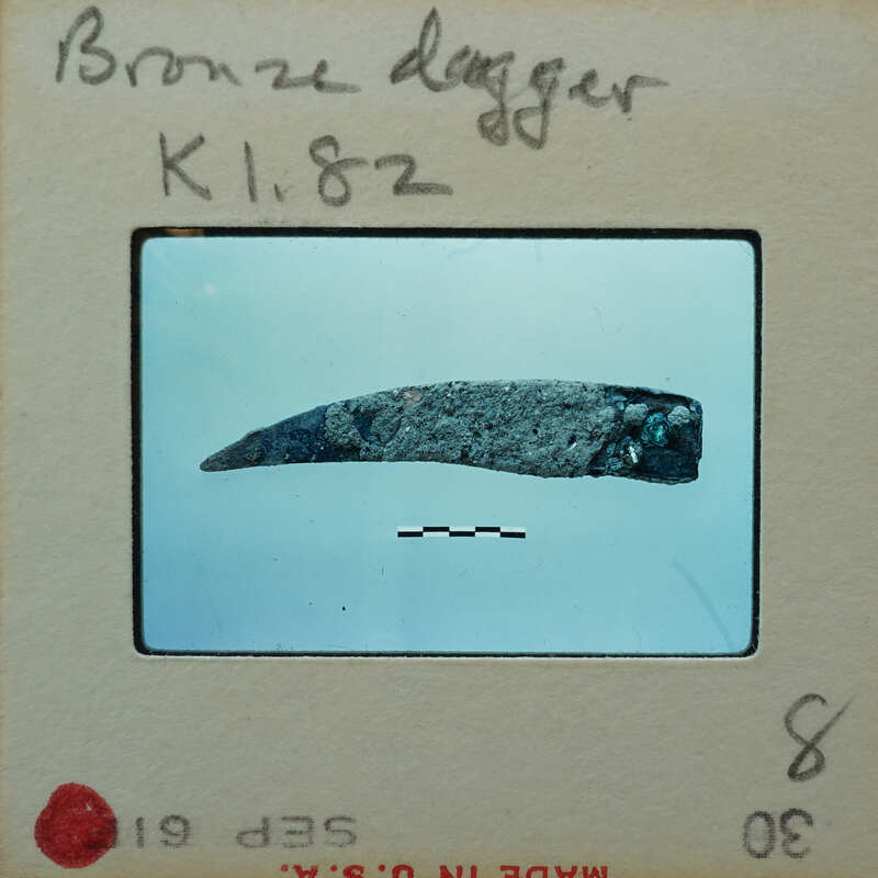 Small metal fragment of what looks to be a small knife, K1.82.