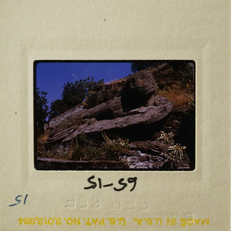 Rock formation with vegetation on top, taken from an elevated perspective.