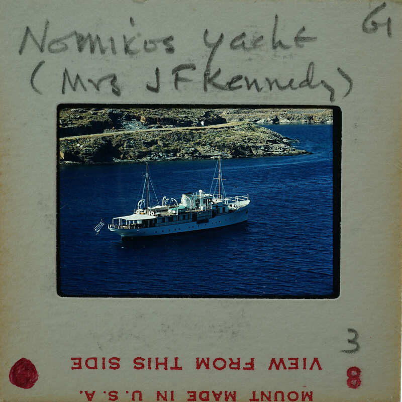 Photo of a boat on water with handwritten names and numbers.