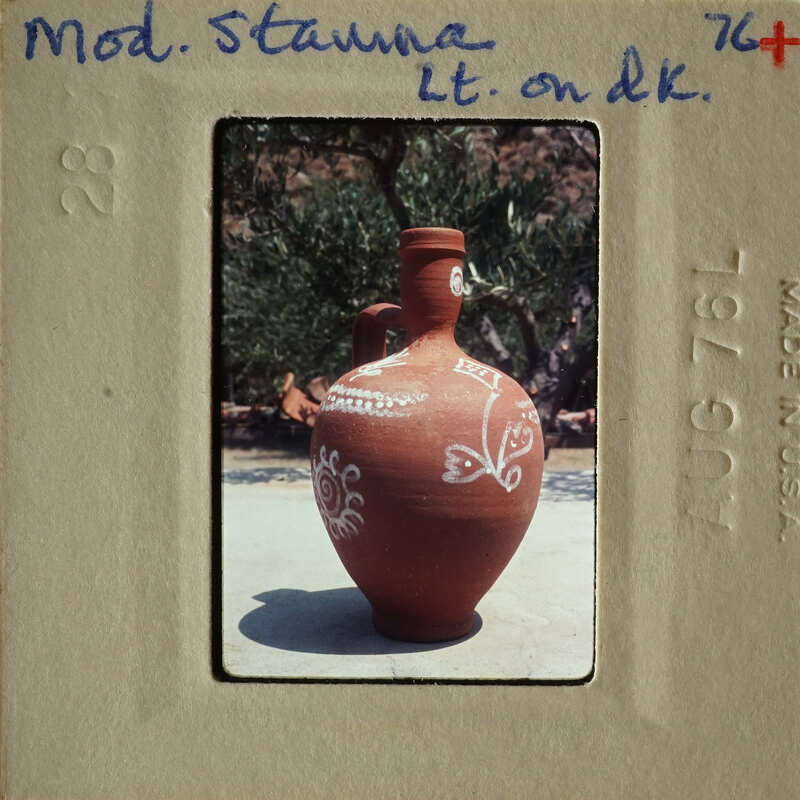 Decorative clay vase with intricate patterns and designs.