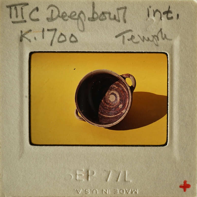 A photograph of an ancient Greek amphora on display.