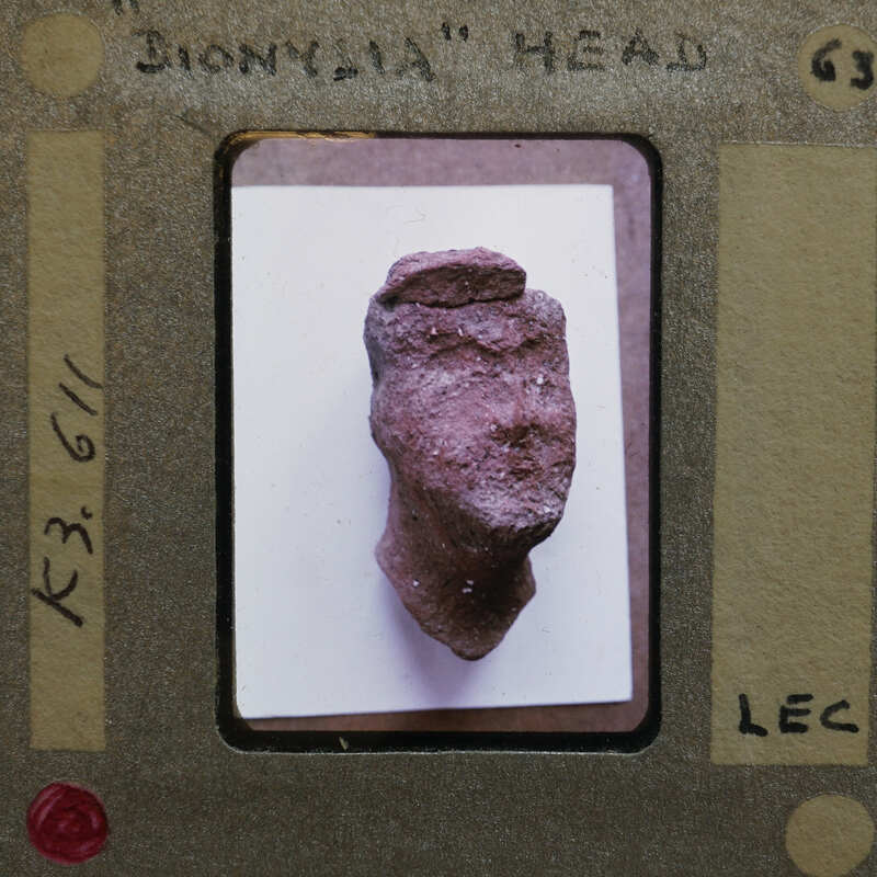 Detail of terracotta figurine K3.611 head from front.