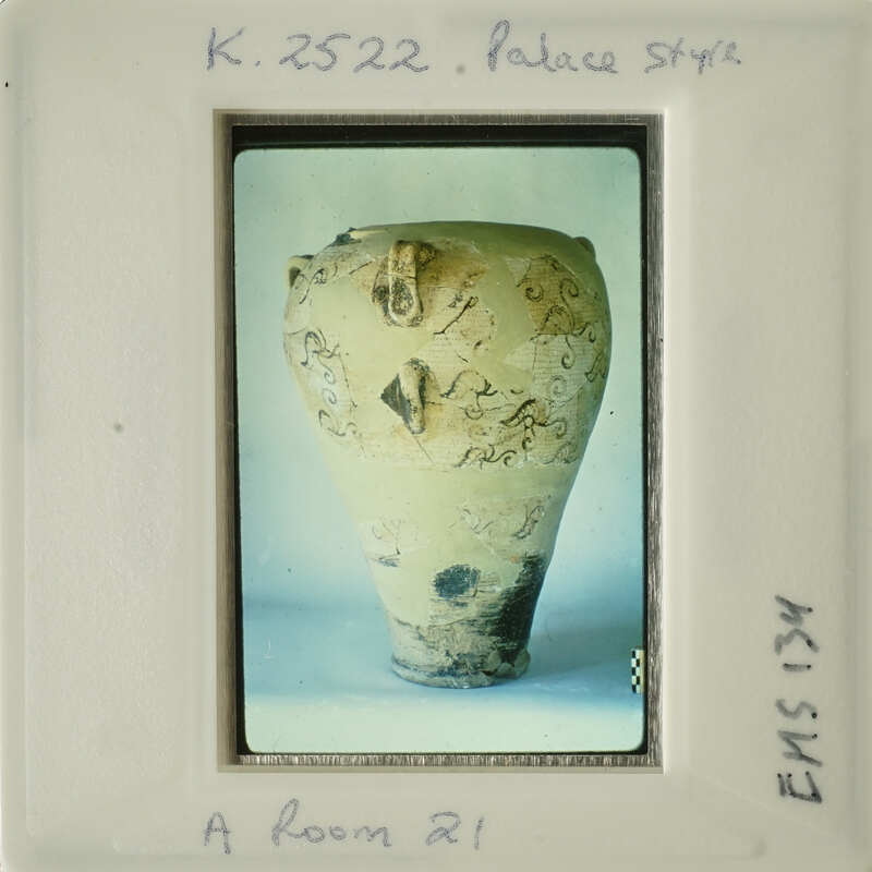 Ancient vase with intricate designs on display.