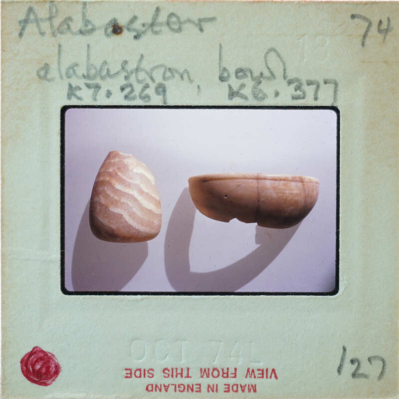 Two broken vessels, tall with wavy patterns on left, short bowl on right, K7.269, K6.377