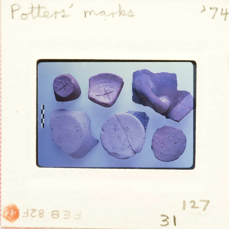 Six fragments of pottery with incised marking on them.