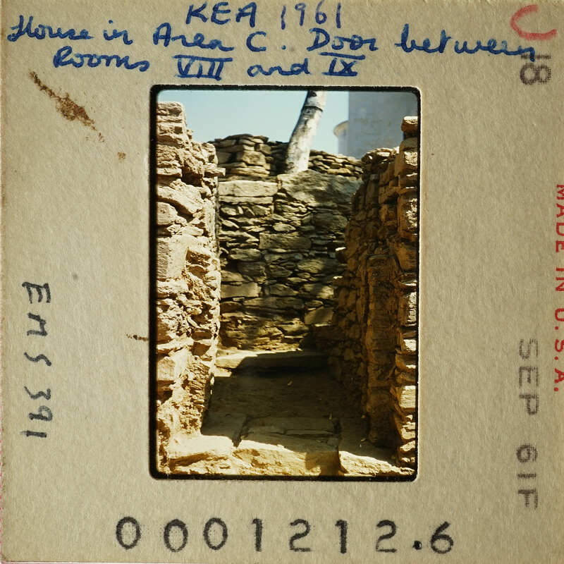 Old photograph of stone ruins with visible damage and erosion, possibly part of an ancient structure.