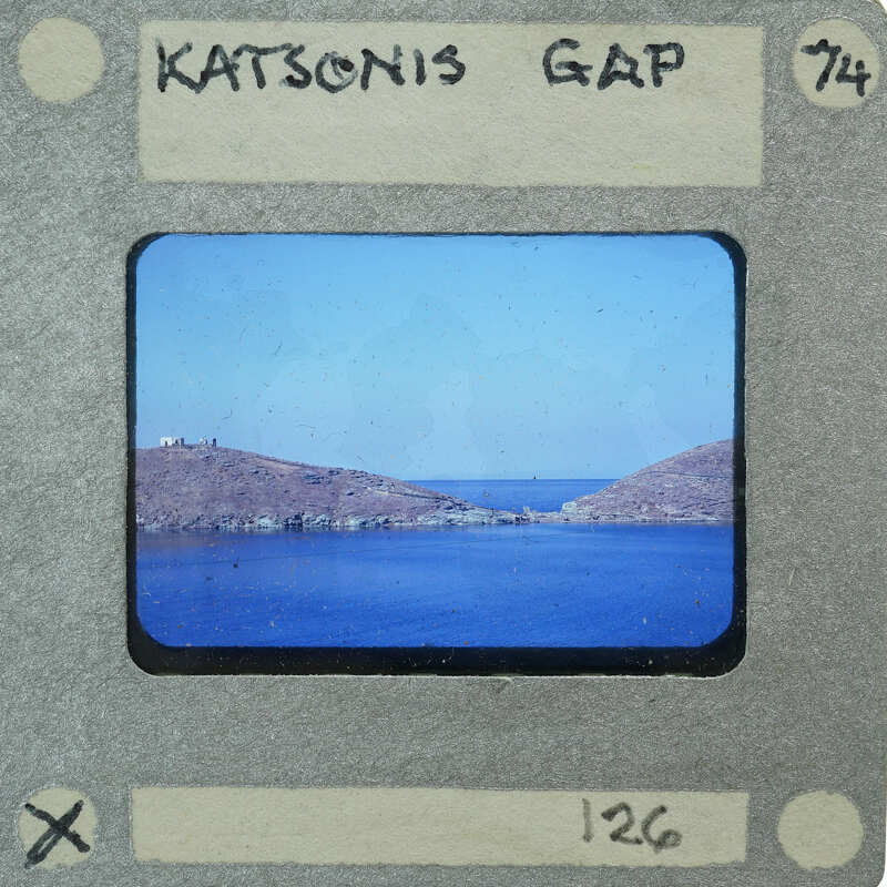 A vintage film strip with a label showing an image of a body of water and land, possibly a lake or sea.