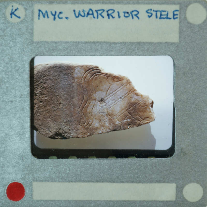 An old photograph of a rock with markings on it, presented as if viewed through a film strip.