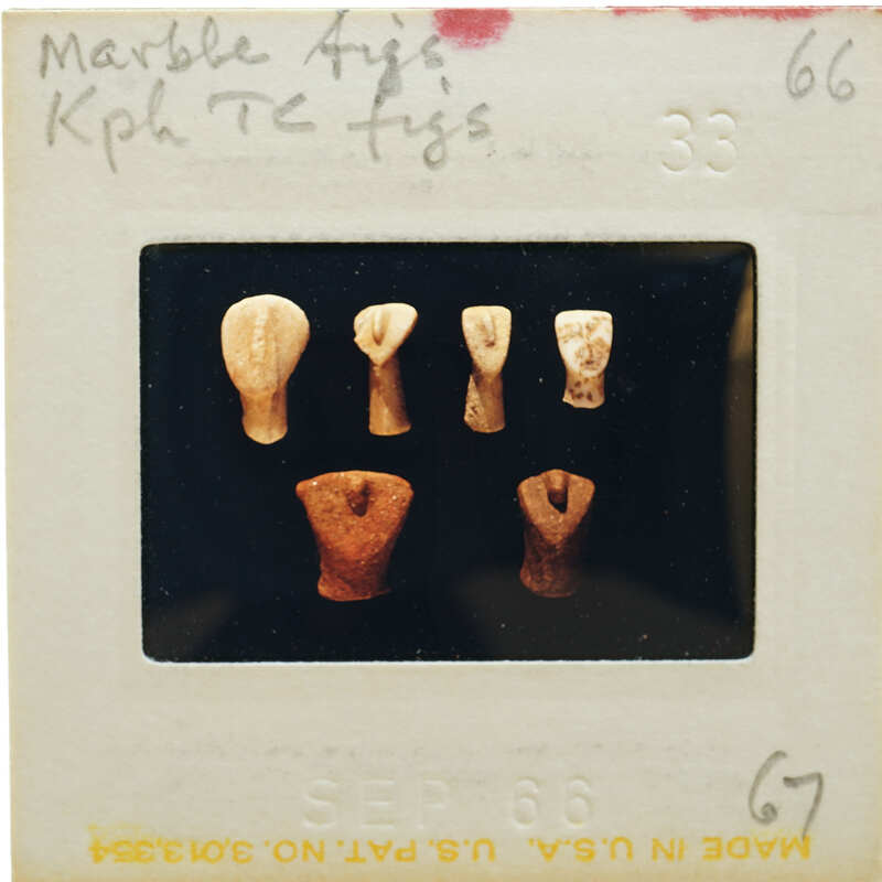 Six terracotta figurines showing faces in various states of repair.