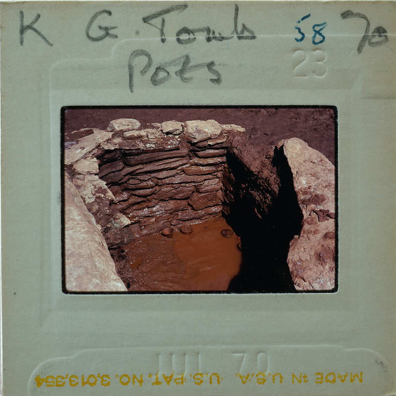 A photograph of a stone-built structure with an open top, possibly a well or pit, taken from above and slightly angled to show the interior.