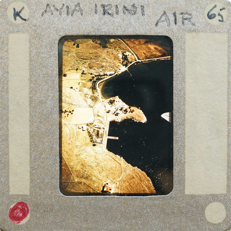 Old photograph of a coastal landscape with buildings and waterways.