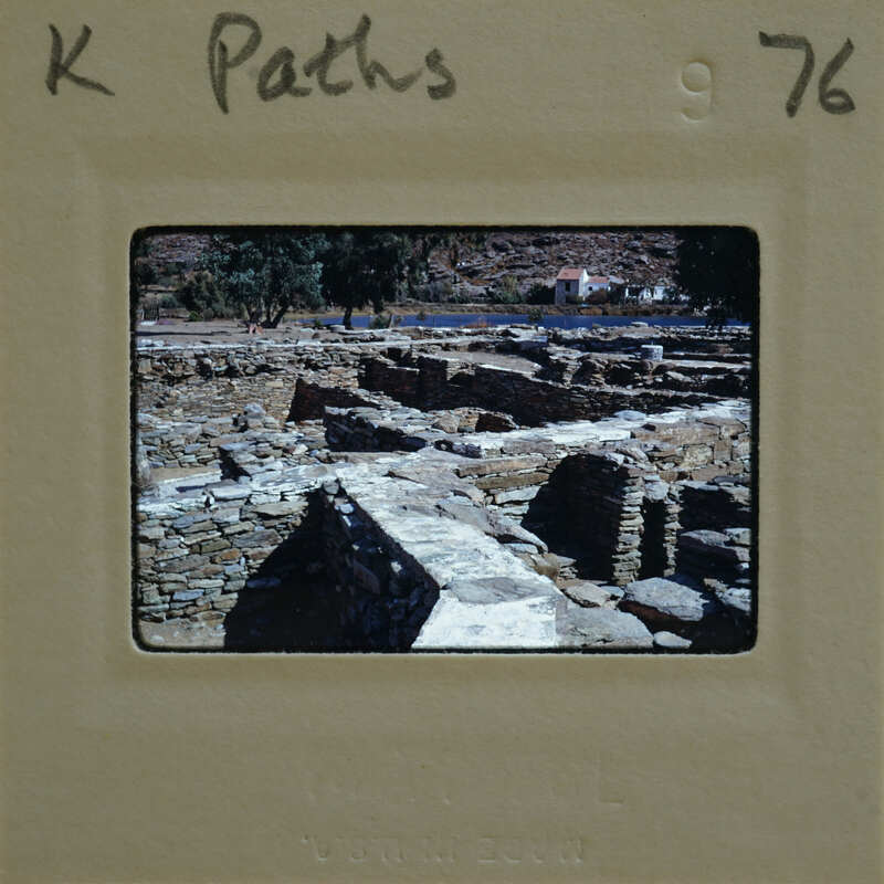 A photograph of ancient ruins on a film strip.