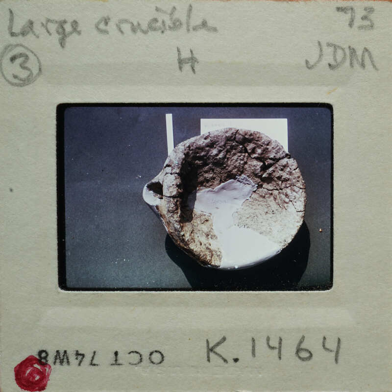 Picture of a broken pottery bowl on a table, with an envelope surrounding it.