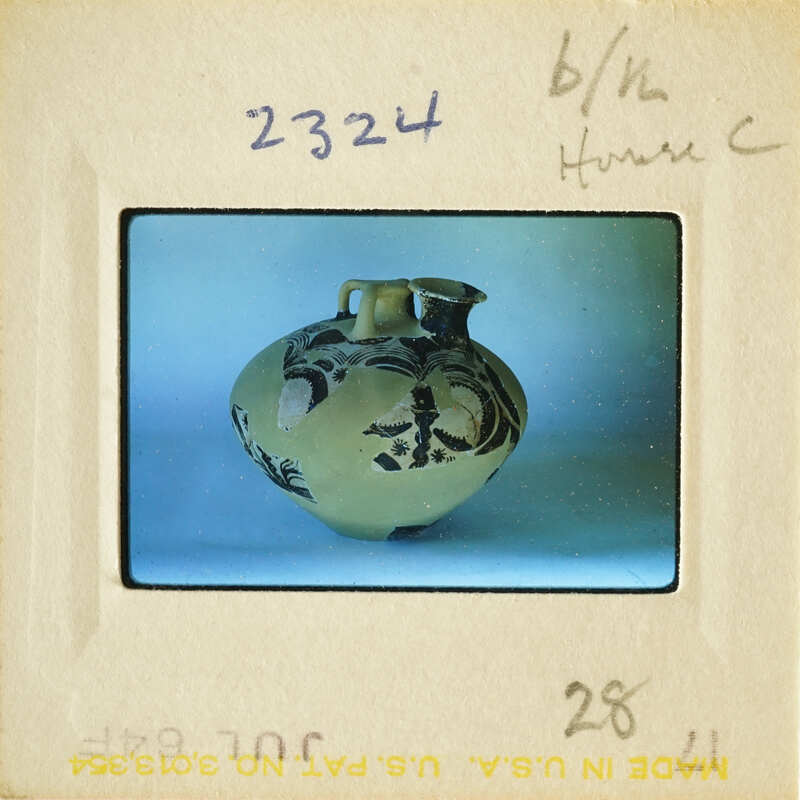 Ancient vase with intricate designs on display.