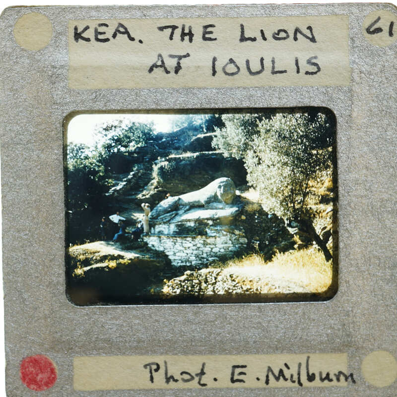The image is a vintage photograph of the Lion at Delos, Greece.