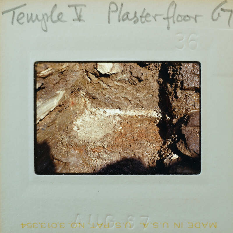 A photograph of a rock surface with markings, possibly from an archaeological site.