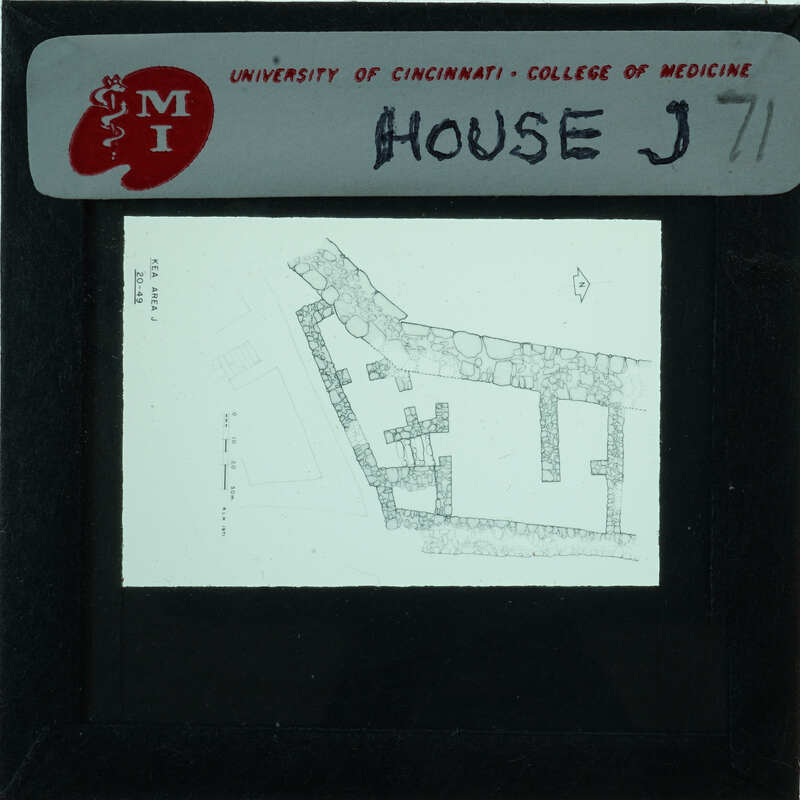 Black and white architectural drawing of a building on a transparency, labeled with "HOUSE J71".