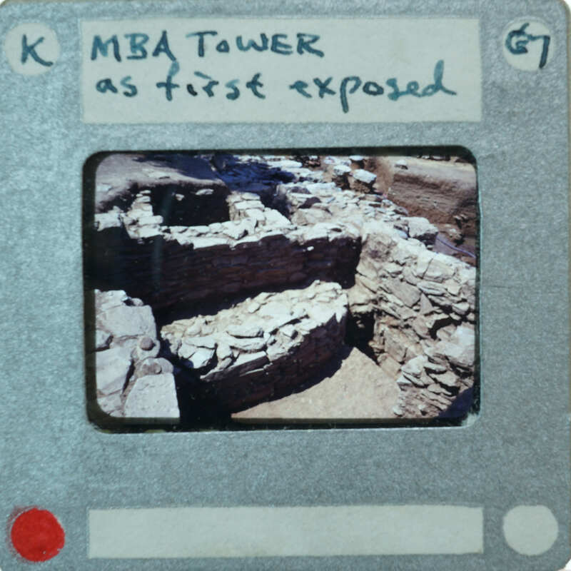 A photograph of a stone structure, possibly ruins or an archaeological site, with handwritten notes indicating it's from the MBA Tower as the first exposed image.