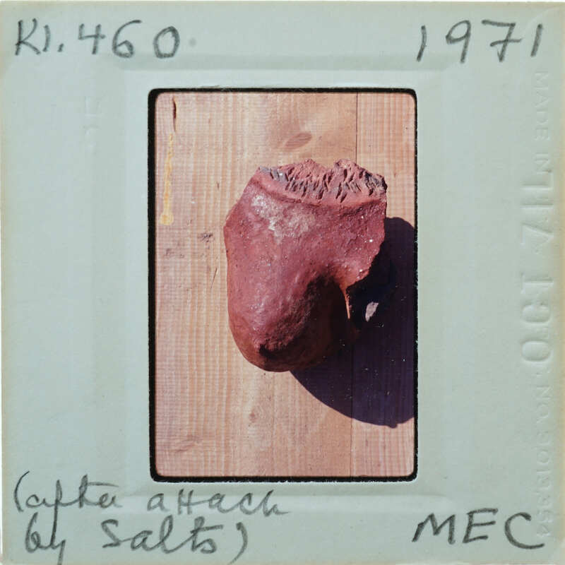 Terracotta breast fragment lying on table K1.460.