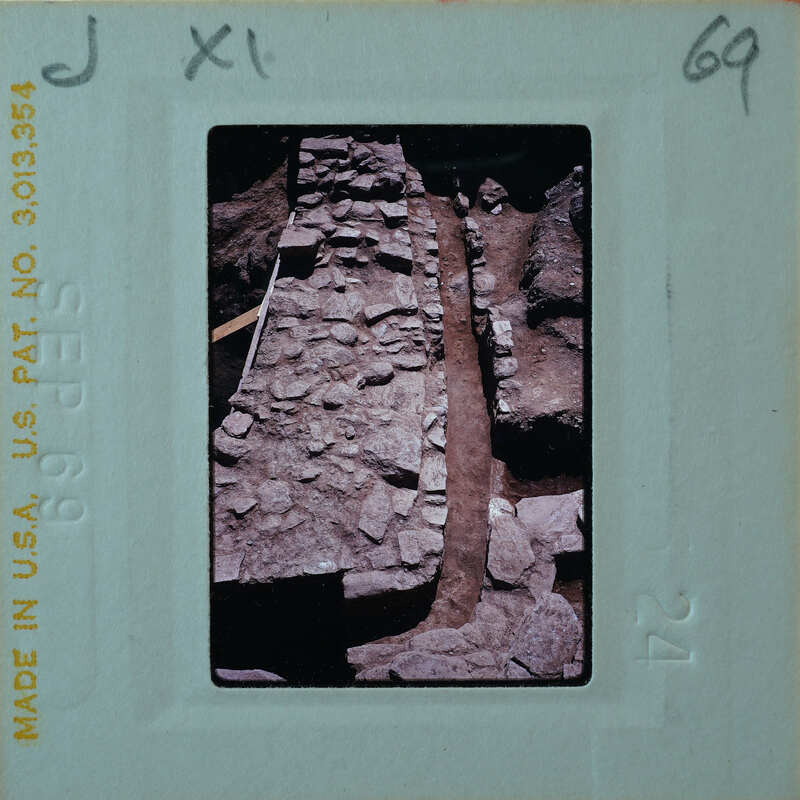 Excavated and repaired stone walls and drain.