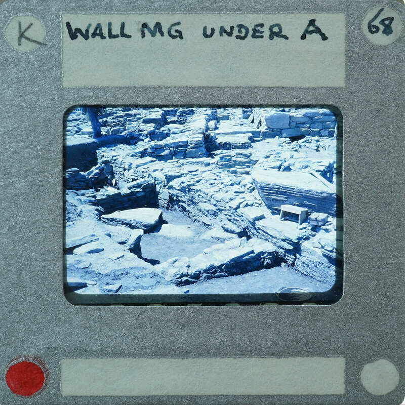 A photograph of a wall, placed on a film strip card.