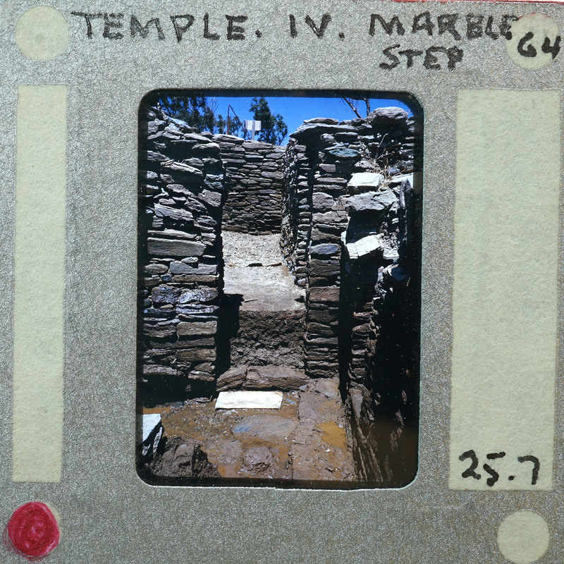 A photograph of a stone structure with doorway.