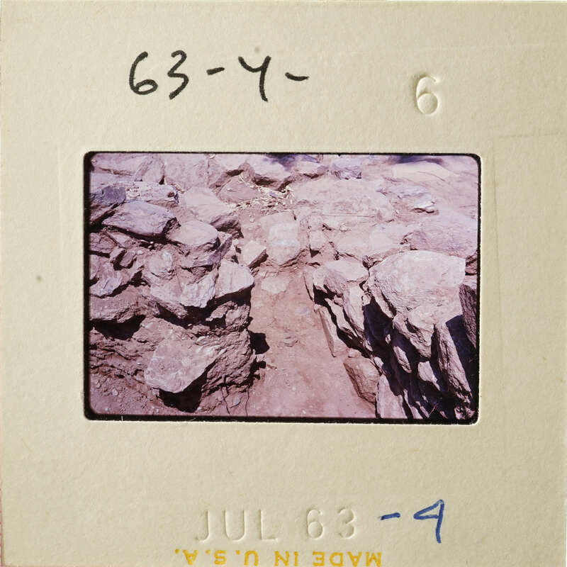 This is an image of a rocky landscape with a dirt path, as seen through a slide viewer.