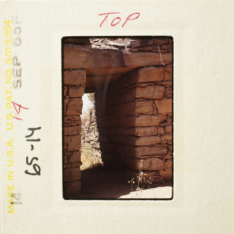 Ancient stone ruins with sunlight streaming through an opening.