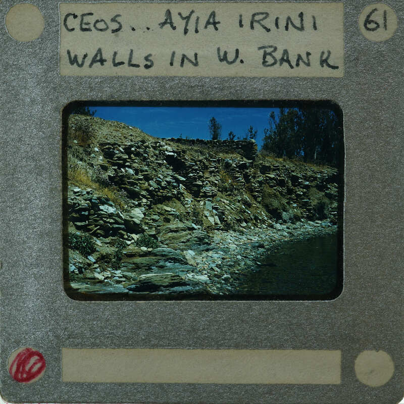 A vintage film strip with a scenic photograph of rocks and water.