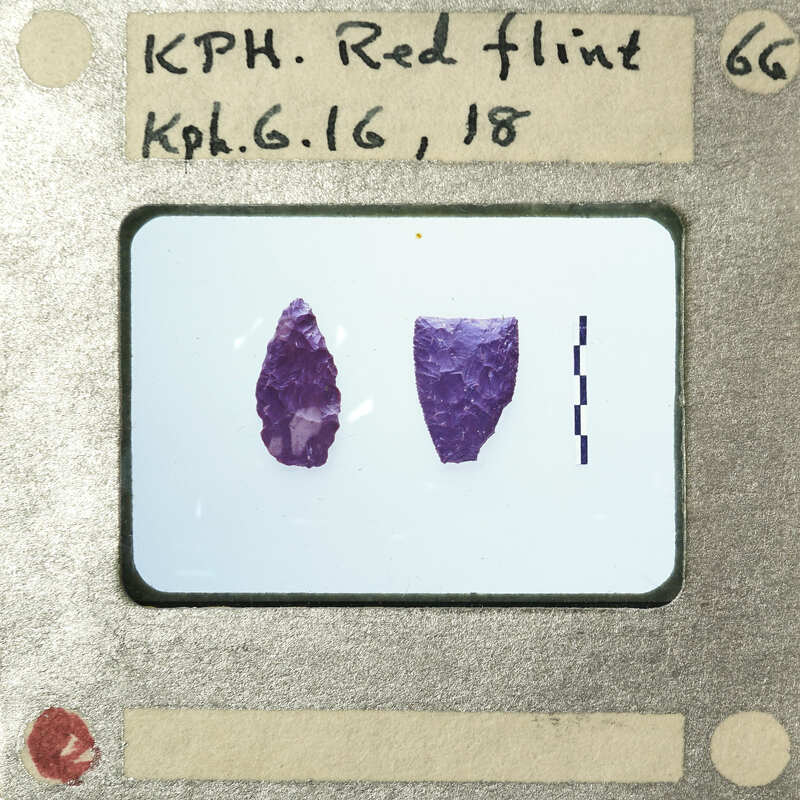 Image of two purple objects with a label indicating "Red Flint" and date.