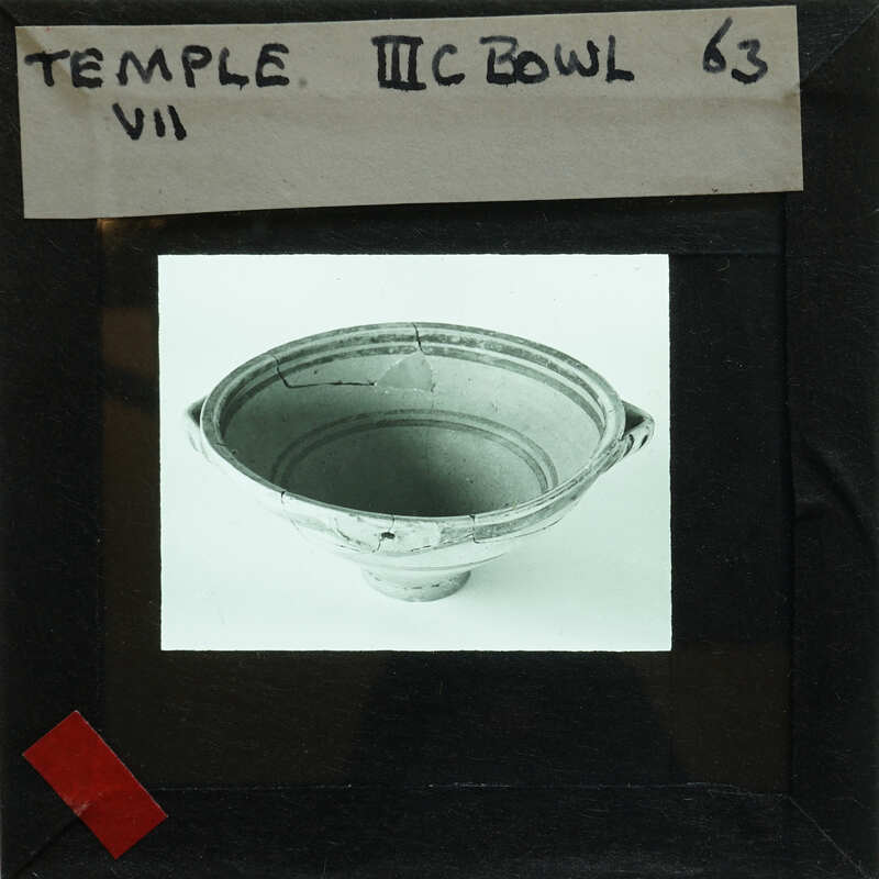 Reassembled decorated bowl on display showing interior.