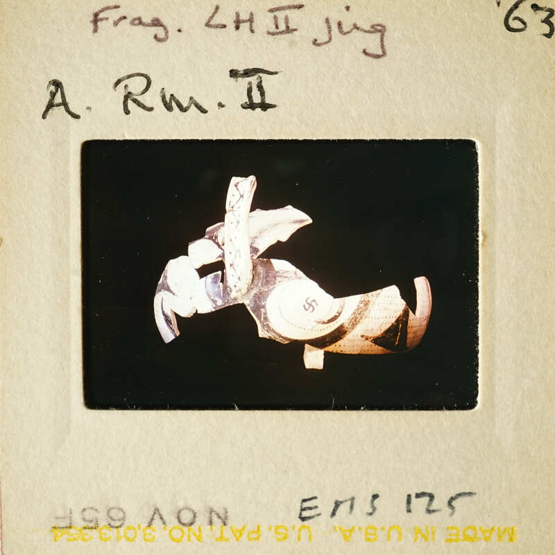 This is an image of a sculpture with a dark background, captured on a film strip.