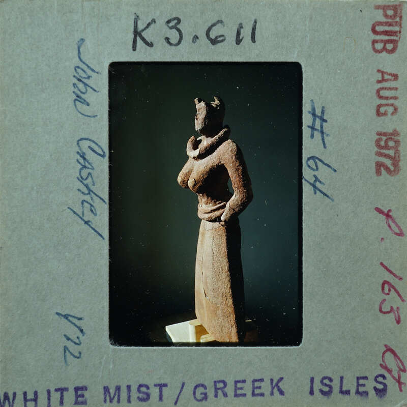 Detail of almost complete terracotta figurine from the side minus right arm.